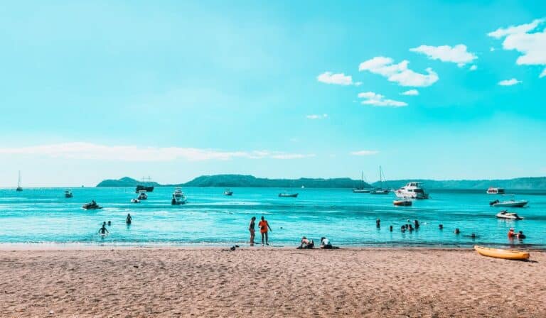 playa hermosa costa rica beach with boats and people