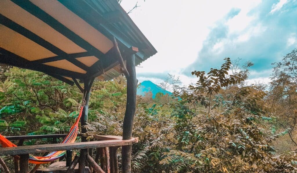 View of Arenal volcano from a porch with hammock