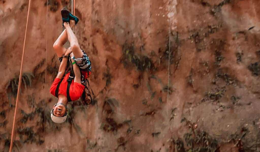 boy upside down canyoning