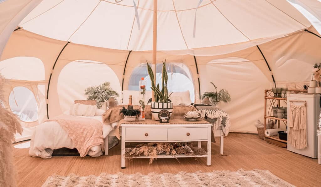 White glamping tent with bed