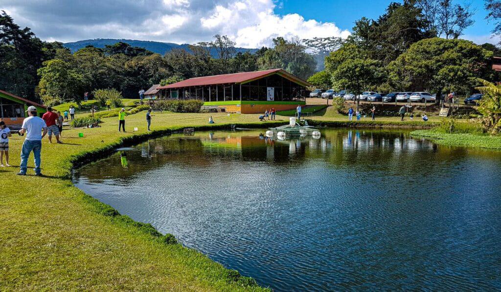 People fishing around small lake in Alajuela, Costa Rica
