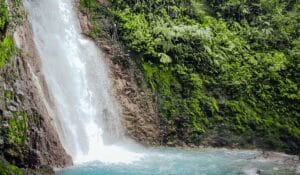 Man rappelling down a waterfall in Costa Rica